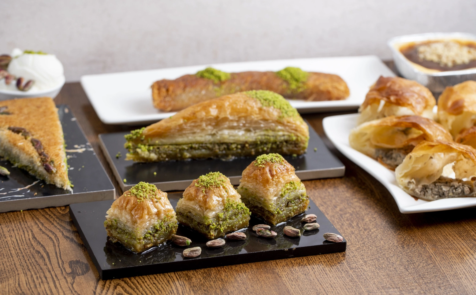 side-view-traditional-turkish-dessert-baklava-with-pistachio-wooden-table_1-1.webp